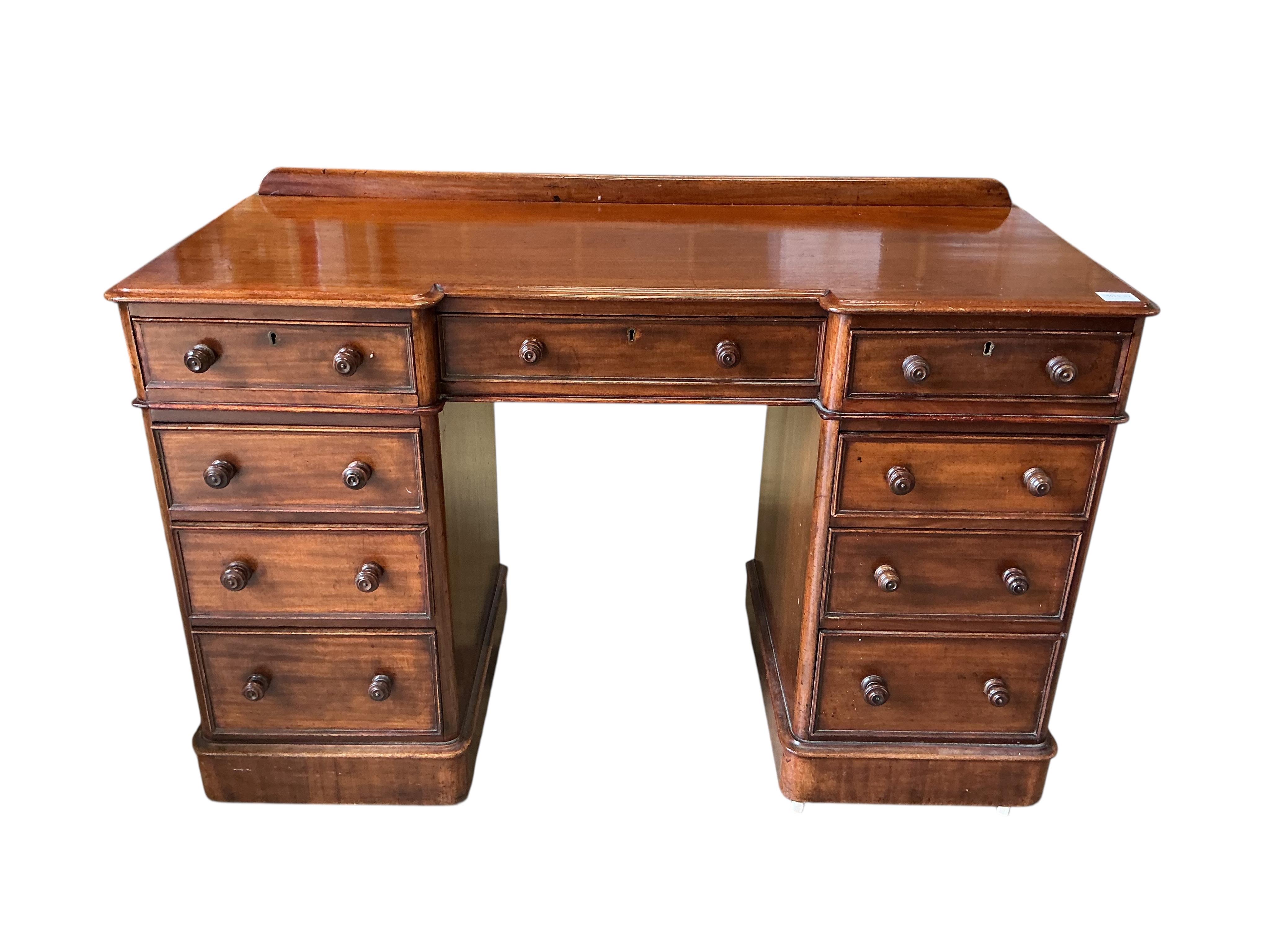 A Victorian mahogany inverse breakfront pedestal dressing table, width 120cm, depth 52cm, height 80cm